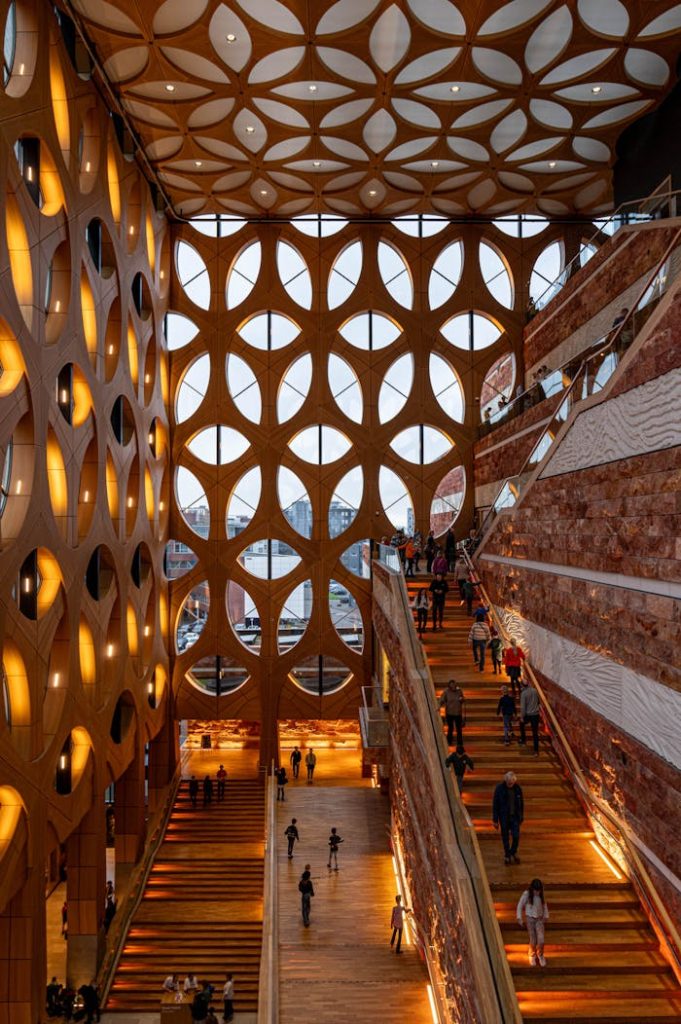 Modern interior with unique architecture, featuring stairs and geometric windows.