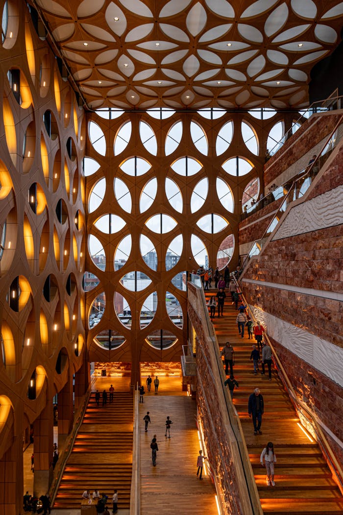 Modern interior with unique architecture, featuring stairs and geometric windows.